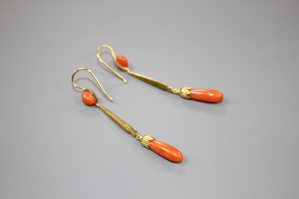 A pair of early-mid 20th century yellow metal (one stamped 15ct) and coral set drop earrings, overall 62mm, gros weight 6 grams.